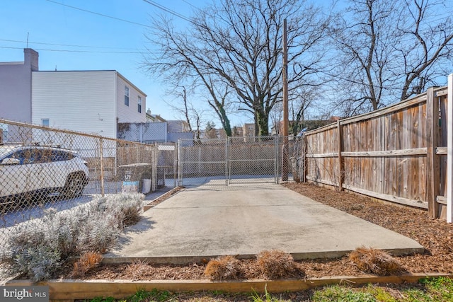 view of yard with fence and a gate