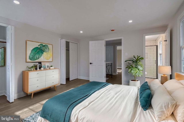 bedroom featuring recessed lighting, light wood-type flooring, ensuite bathroom, and baseboards