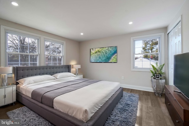 bedroom featuring recessed lighting, baseboards, and dark wood-style flooring