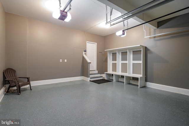 15200 Spotted Turtle Ct, Woodbridge, VA 22193 - garage with baseboards and a garage door opener