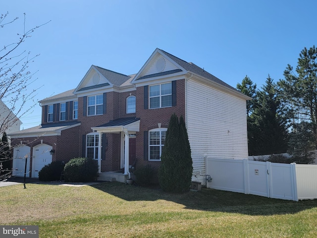 15200 Spotted Turtle Ct, Woodbridge, VA 22193 - view of front of property with brick siding, a garage, a front lawn, and fence