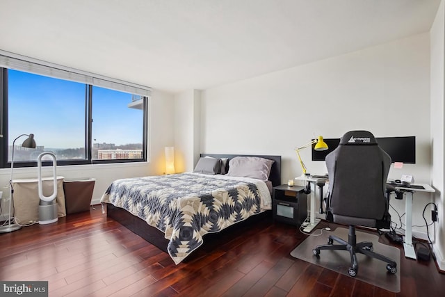 bedroom with wood finished floors