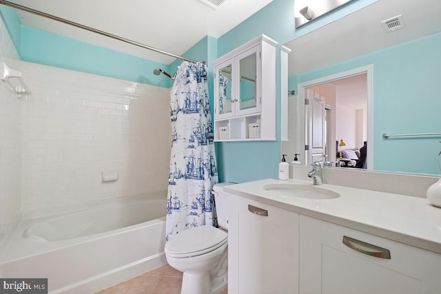 full bathroom featuring tile patterned floors, visible vents, toilet, shower / tub combo with curtain, and vanity