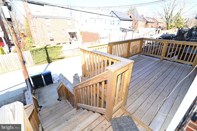 wooden terrace featuring fence