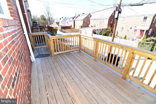 deck with fence and a residential view