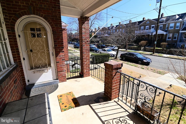 exterior space with a residential view and a porch