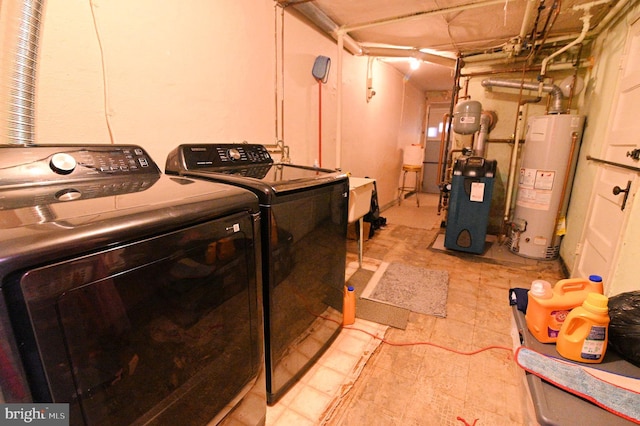 laundry area featuring independent washer and dryer, a heating unit, and water heater