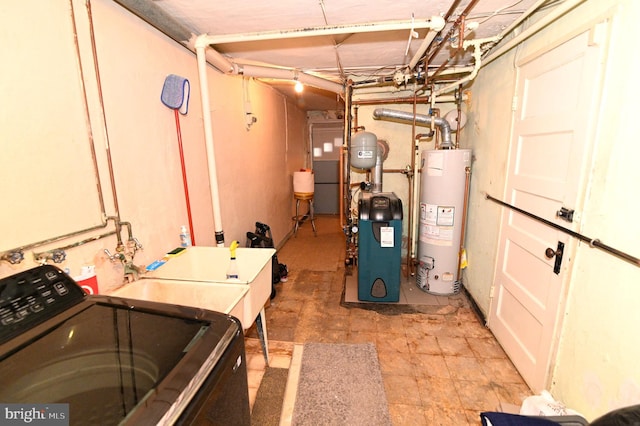 clothes washing area with gas water heater, washer / dryer, a heating unit, and a sink