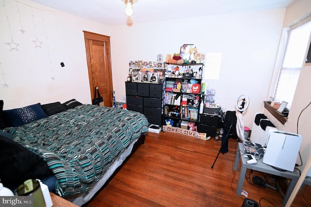 bedroom featuring wood finished floors