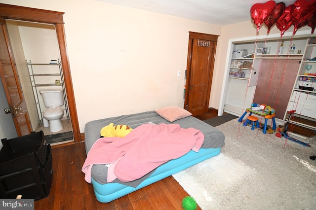 bedroom featuring wood finished floors