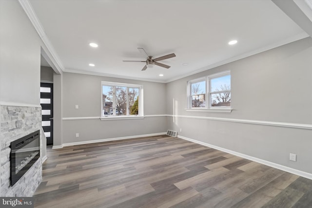 unfurnished living room featuring baseboards, ceiling fan, ornamental molding, recessed lighting, and wood finished floors