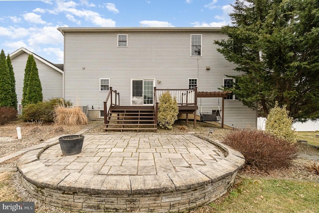 back of house with a patio, an outdoor fire pit, and a deck