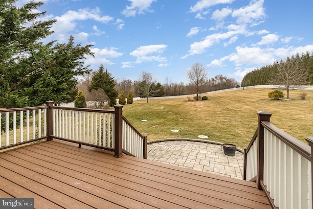 deck with a patio and a lawn