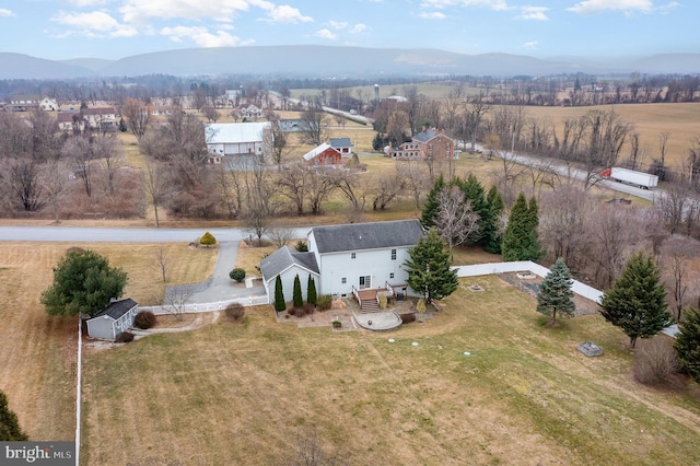 birds eye view of property with a rural view and a mountain view