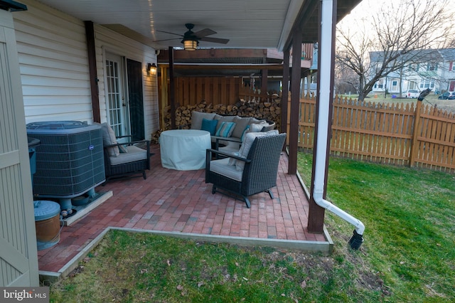 view of patio with an outdoor hangout area, central AC, ceiling fan, and fence