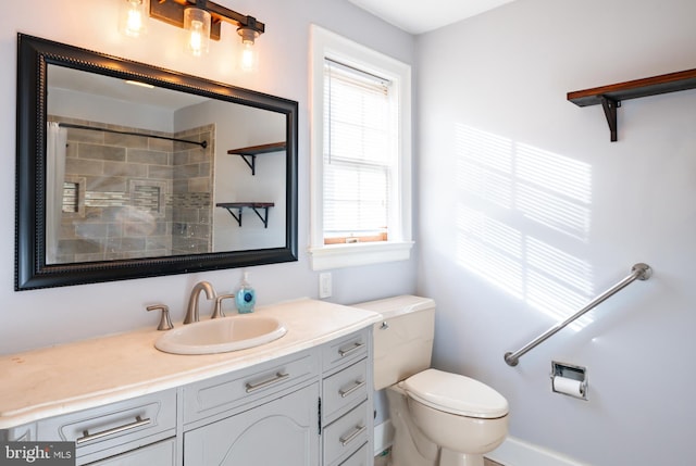 full bathroom with vanity, toilet, and a shower