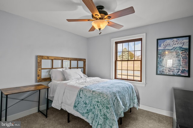 bedroom featuring a ceiling fan, carpet, and baseboards