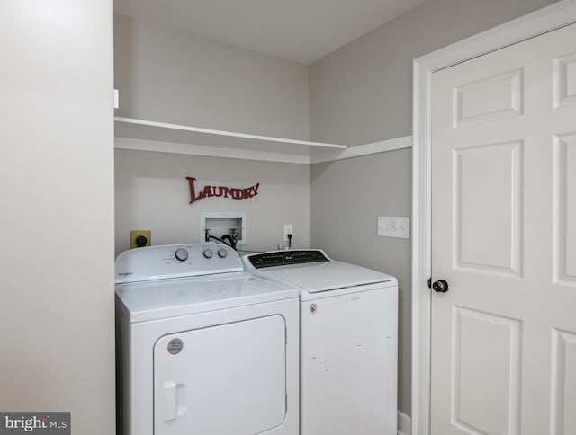 washroom featuring laundry area and separate washer and dryer