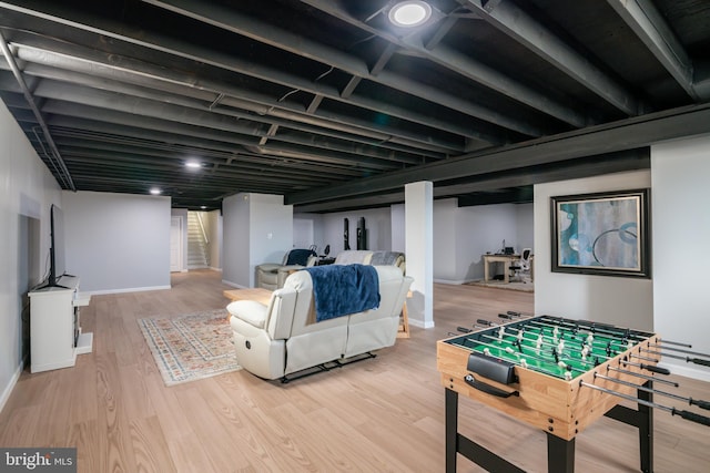 game room featuring wood finished floors and baseboards