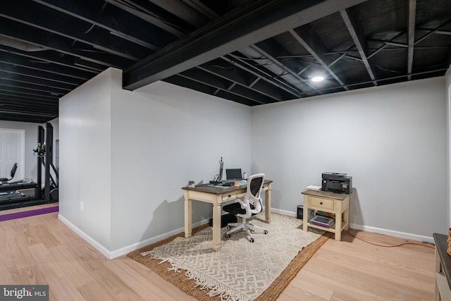 office with baseboards and wood finished floors