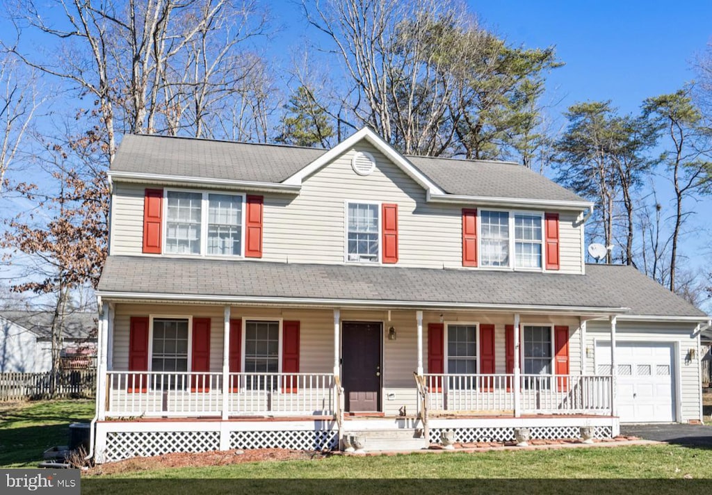 view of front facade with a front yard, roof with shingles, a porch, an attached garage, and aphalt driveway