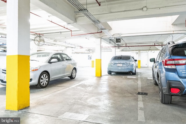 parking garage featuring a garage door opener