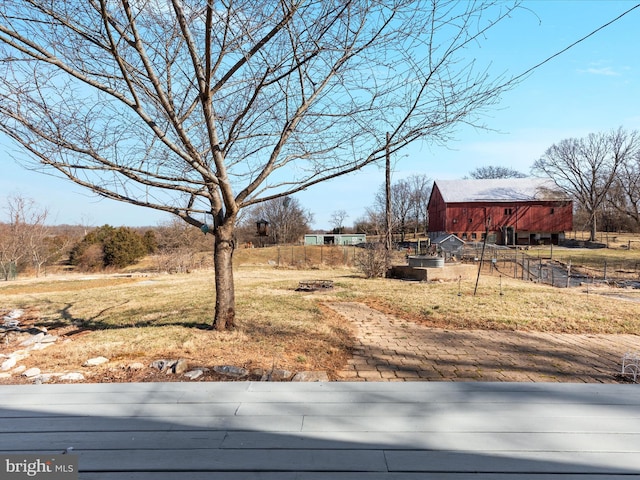 view of yard with an outbuilding and a barn