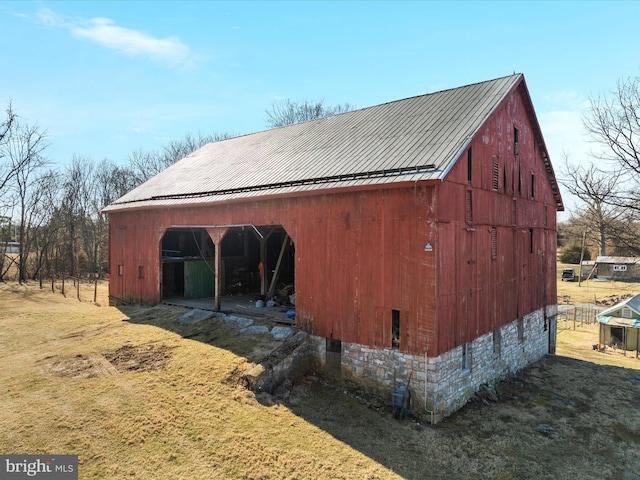 view of barn with a lawn