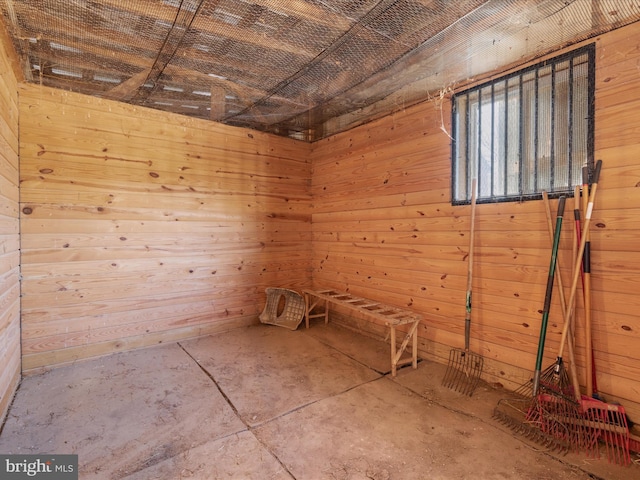 interior space featuring wooden walls