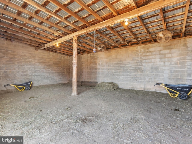 miscellaneous room featuring concrete block wall