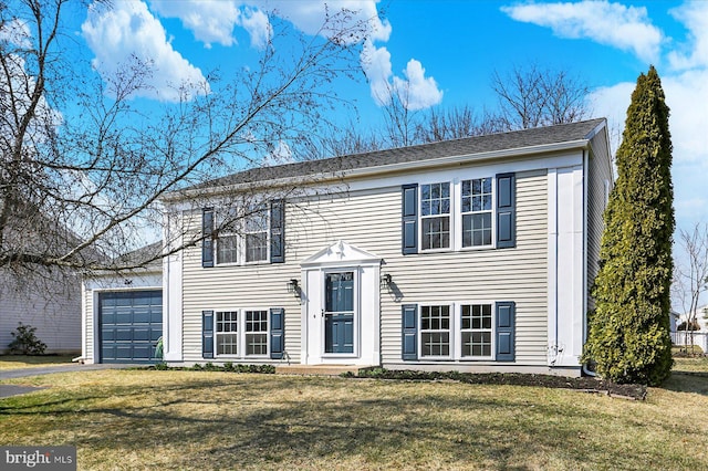 raised ranch with a garage and a front yard