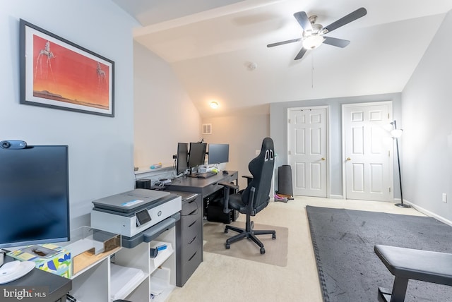 office space with ceiling fan, lofted ceiling, baseboards, and light carpet