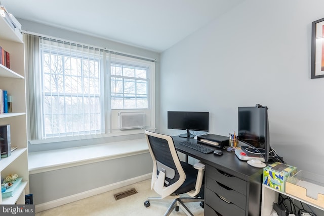 office area featuring visible vents, baseboards, and cooling unit