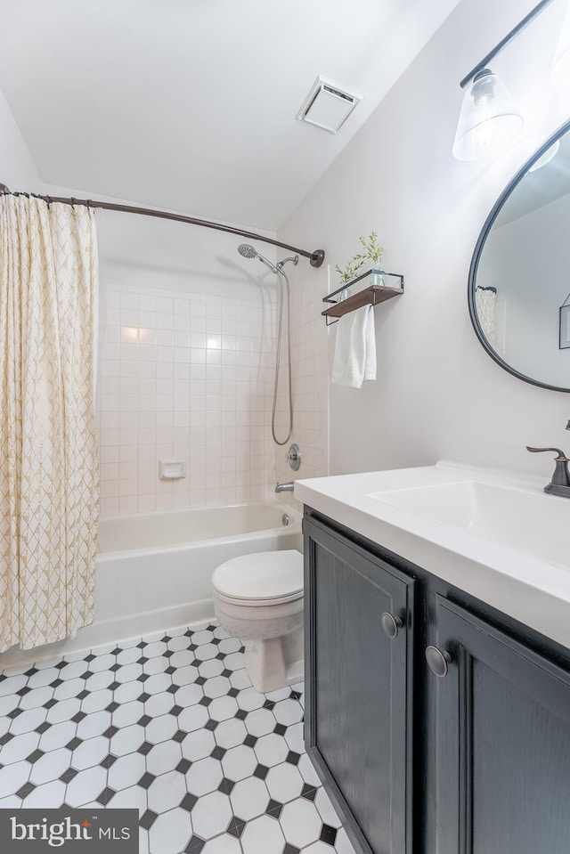 full bath with vanity, visible vents, shower / bath combination with curtain, tile patterned floors, and toilet