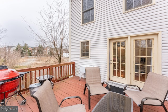 wooden deck featuring french doors