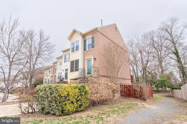 view of property exterior with fence