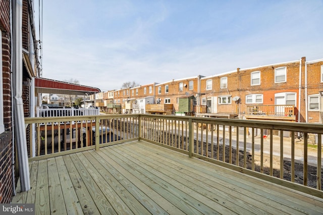 wooden deck featuring a residential view