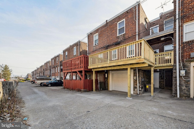 rear view of property with an attached garage