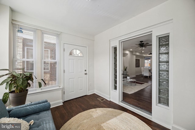 entrance foyer with visible vents, baseboards, and wood finished floors