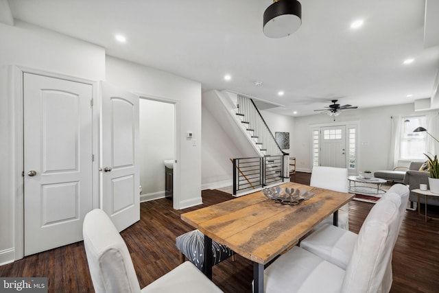 dining room featuring recessed lighting, wood finished floors, and stairs