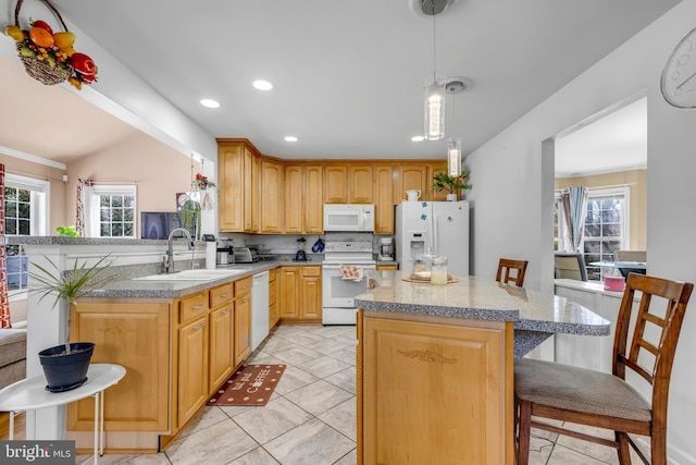 kitchen featuring a sink, white appliances, a breakfast bar area, and vaulted ceiling