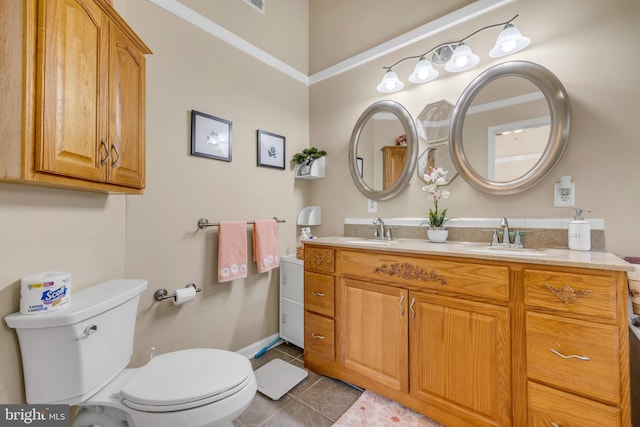 bathroom featuring tile patterned floors, toilet, and vanity