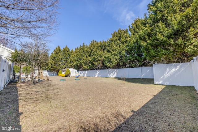 view of yard featuring a fenced backyard