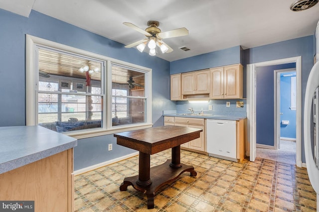 kitchen with visible vents, ceiling fan, light brown cabinetry, light floors, and white dishwasher