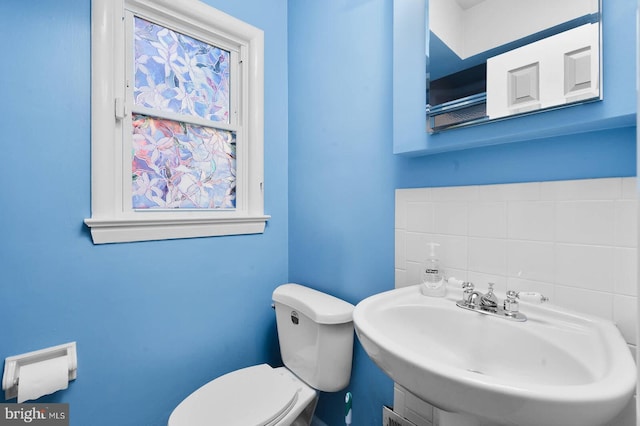 bathroom featuring toilet and a sink