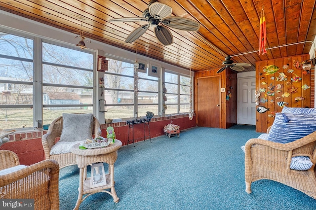 sunroom / solarium featuring wooden ceiling and ceiling fan