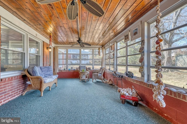 sunroom with wooden ceiling, ceiling fan, and vaulted ceiling