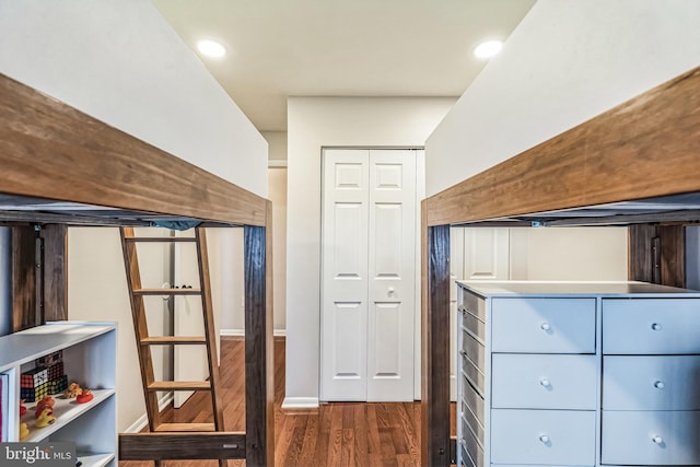 spacious closet with dark wood finished floors