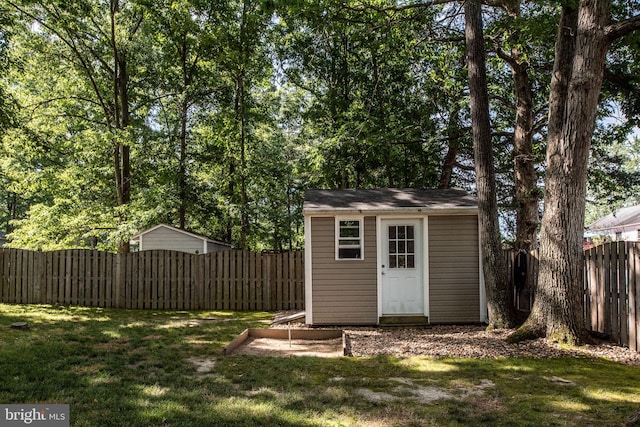 view of shed featuring a fenced backyard