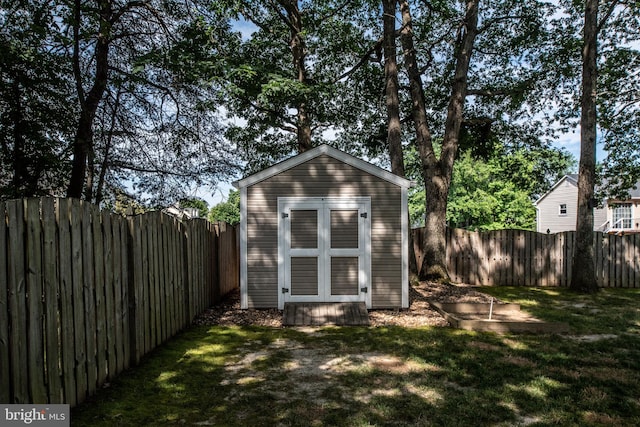 view of shed featuring a fenced backyard